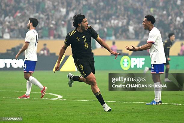 Mexico's forward Raul Jimenez celebrates scoring his team's first goal during the Concacaf Gold Cup final football match between Mexico and USA at...