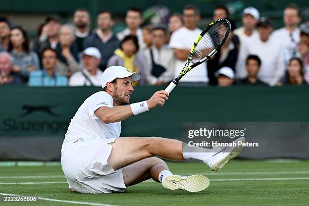 Botic Van De Zandschulp of Netherlands looks on after falling over during his Gentlemen's Singles second round match against Alejandro Davidovich...