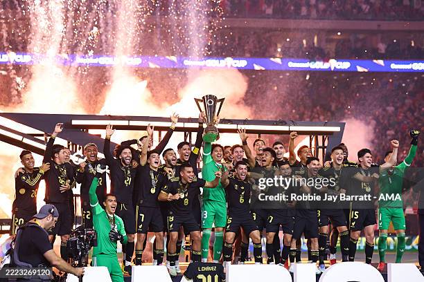 Edson Alvarez of Mexico and Guillermo Ochoa of Mexico lift the Gold Cup trophy with team mates during the Gold Cup 2025 Final match between United...