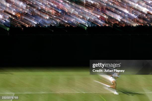 Karen Khachanov plays a backhand against Shintaro Mochizuki of Japan during the Gentlemen's Singles second round match on day three of The...