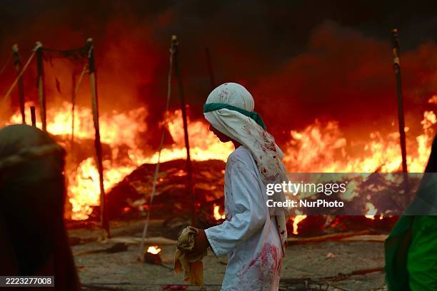 Iraqis take part in a reenactment commemorating the events of the Battle of Karbala during the Islamic month of Muharram, in Nasiriyah, Dhi Qar...
