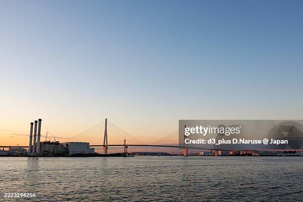 the first sunrise and tsurumi-tsubasa bridge. - tsubasa stock pictures, royalty-free photos & images