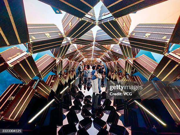 People visit the "The Louis", Louis Vuitton's new multi-sensory flagship store shaped like a ship, on July 2, 2025 in Shanghai, China. Taking the...