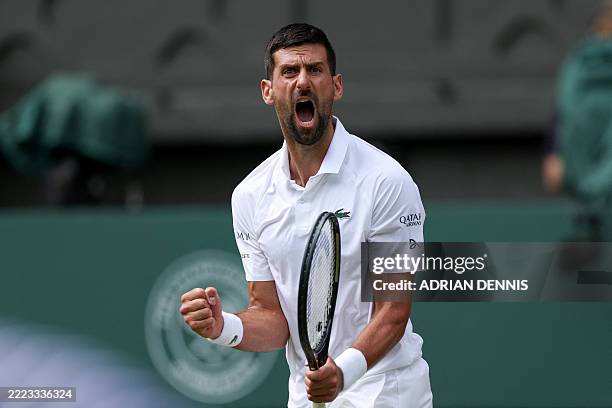 Serbia's Novak Djokovic reacts as he plays against Australia's Alex De Minaur during their men's singles fourth round tennis match on the eighth day...