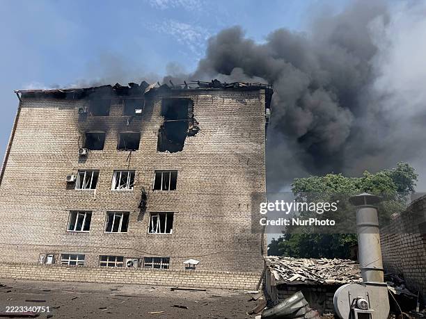 Plume of black smoke rises over the area where a Russian attack drone lands near the Zaporizhzhia Regional Territorial Recruitment Centre in...
