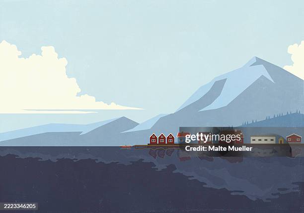 houses in a row at waterfront along blue lake below mountain - blue water surface stock illustrations