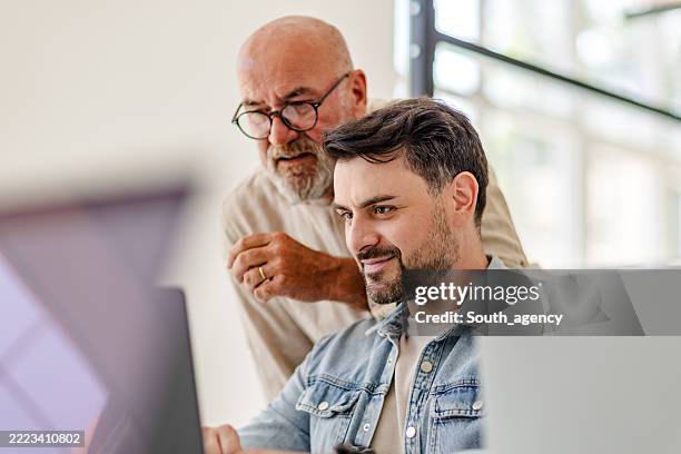 collaboration in a scandinavian office setting with professionals working on technology projects - scandinavian descent stock pictures, royalty-free photos & images