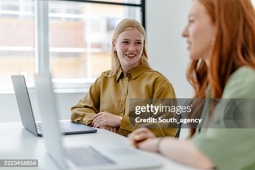 Collaboration among professionals in a modern Scandinavian office during a productive business meeting Collaboration among professionals in a modern Scandinavian office during a productive business meeting