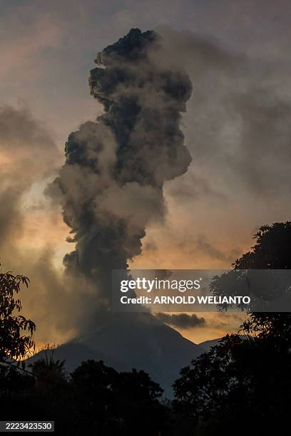 Mount Lewotobi Laki-laki erupts as seen from Boru village in East Flores, East Nusa Tenggara on July 8, 2025.
