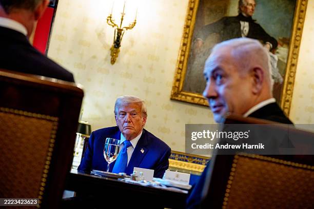 Israeli Prime Minister Benjamin Netanyahu, accompanied by U.S. President Donald Trump , speaks during a dinner in the Blue Room of the White House on...