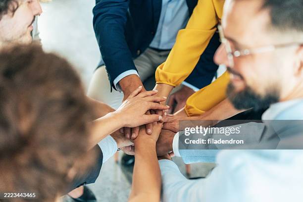 successful team - hand stack stock pictures, royalty-free photos & images
