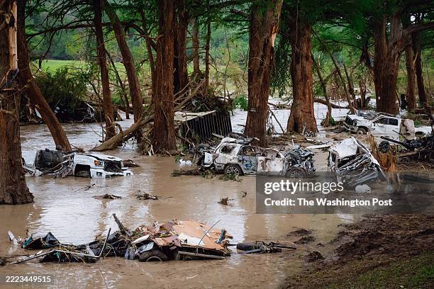 Wrecked vehicles and trailers along the Guadalupe River in Kerrville, Texas on Sunday, July 6, 2025.