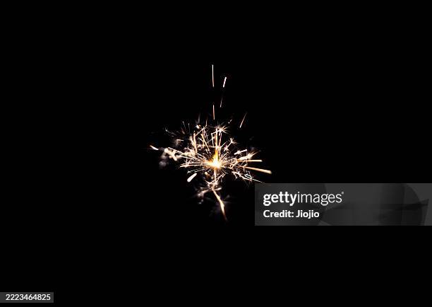 burning sparkler background - vonk stockfoto's en -beelden