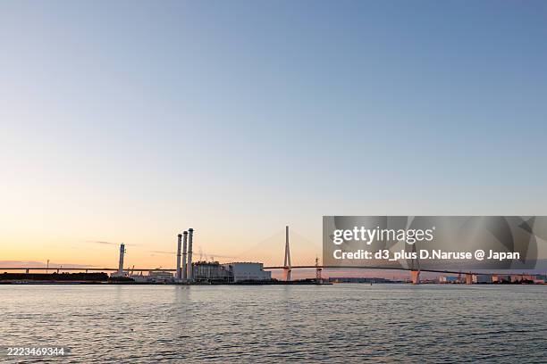 the first sunrise and tsurumi-tsubasa bridge. - tsubasa stock pictures, royalty-free photos & images