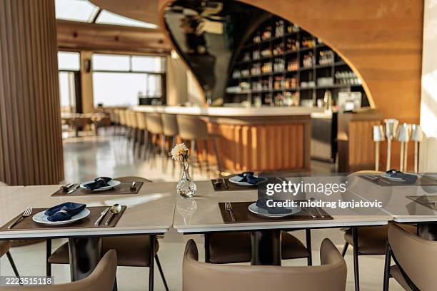 sunlit table setting in rooftop bar - gymnastics bar stock pictures, royalty-free photos & images