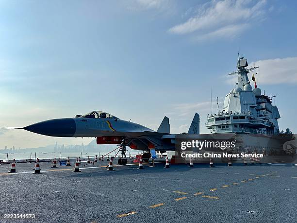 Carrier-based fighter jet is displayed during the open event of aircraft carrier Shandong on July 4, 2025 in Hong Kong, China. A naval fleet led by...