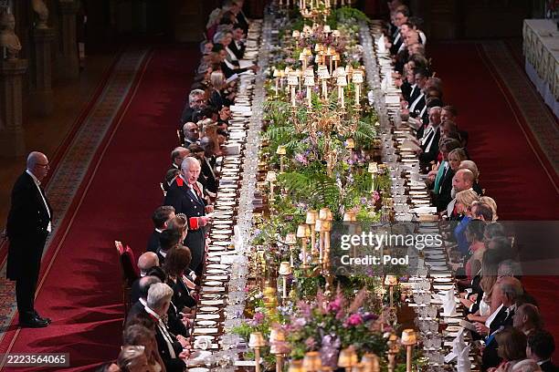 Britain's King Charles III delivers a speech during the State Banquet for President of France Emmanuel Macron and his wife Brigitte Macron, at...