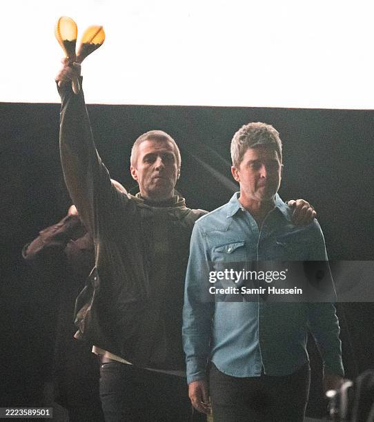 Liam Gallagher and Noel Gallagher of Oasis perform during the opening night of their Live 25' Tour at Principality Stadium on July 04, 2025 in...