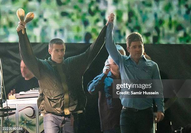 Liam Gallagher and Noel Gallagher of Oasis perform during the opening night of their Live 25' Tour at Principality Stadium on July 04, 2025 in...