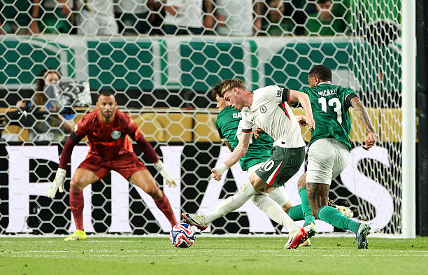 Cole Palmer of Chelsea FC scores his team's first goal during the FIFA Club World Cup 2025 quarter final match between SE Palmeiras and Chelsea FC at...