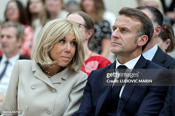 France's President Emmanuel Macron and his wife Brigitte Macron attend a ceremony during their visit to The British Museum in London on July 9 during...