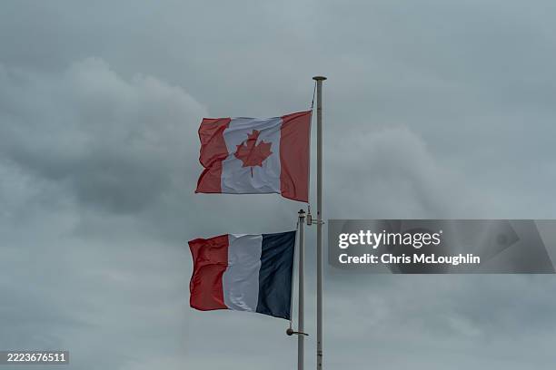 canadian and french flags at bény-sur-mer war cemetery, normandy - canadian flag stock pictures, royalty-free photos & images