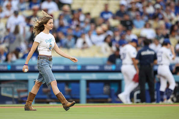 Emily Rudd Before Actress Emily Rudd walks out to throw the first pitch before the game ...