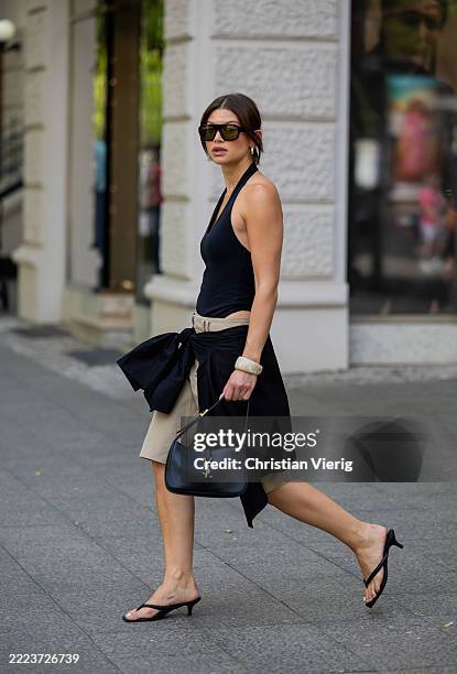 Sophia Geiss wears shoes LeGer by lena Gercke, beige shorts Drykorn, black body Mango, button shirt h&m, sunglasses vehla eyewear, bag YSL on July...