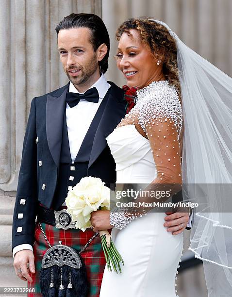 Rory McPhee and Mel B depart following their wedding in the OBE Chapel at St Paul's Cathedral on July 5, 2025 in London, England.