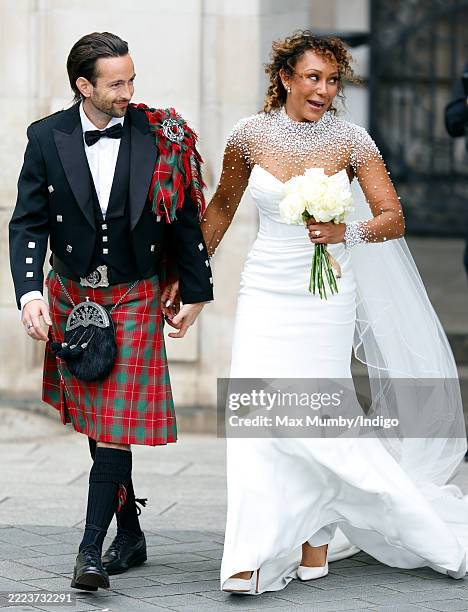 Rory McPhee and Mel B depart following their wedding in the OBE Chapel at St Paul's Cathedral on July 5, 2025 in London, England.