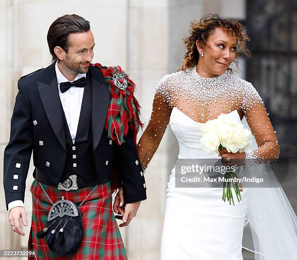 Rory McPhee and Mel B depart following their wedding in the OBE Chapel at St Paul's Cathedral on July 5, 2025 in London, England.