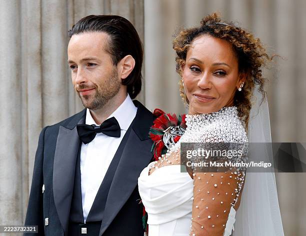 Rory McPhee and Mel B depart following their wedding in the OBE Chapel at St Paul's Cathedral on July 5, 2025 in London, England.