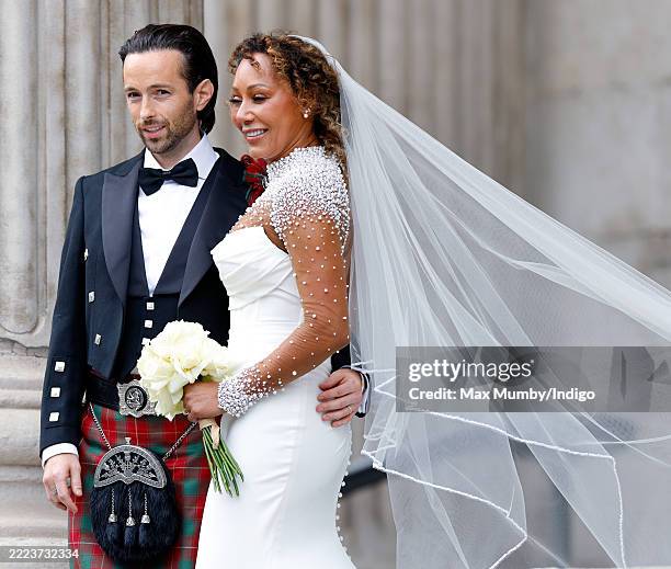 Rory McPhee and Mel B depart following their wedding in the OBE Chapel at St Paul's Cathedral on July 5, 2025 in London, England.