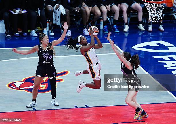 Indiana Fever guard Aari McDonald takes a shot against Golden State Valkyries guard Carla Leite on July 9 at Gainbridge Fieldhouse in Indianapolis,...
