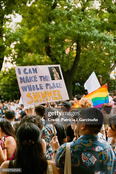 Sign that says "I can make the whole place shimmer" with a photo of Taylor Swif is seen in the MADO Madrid Pride 2025 parade at Paseo del Prado on...