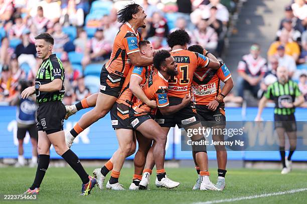 Samuela Fainu of the Tigers celebrates scoring a try during the round 18 NRL match between Sydney Roosters and Wests Tigers at Allianz Stadium, on...