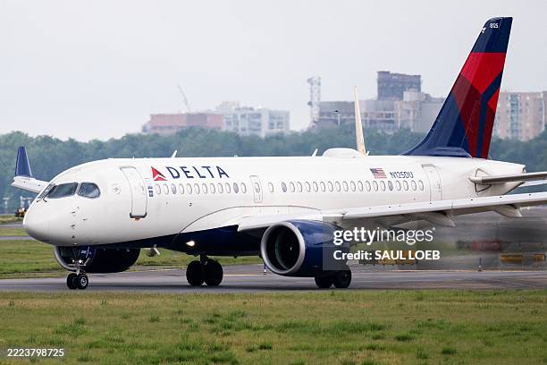 Delta Air Lines Airbus A220 airplane prepares to takeoff at Ronald Reagan Washington National Airport in Arlington, Virginia, on July 10, 2025. Delta...