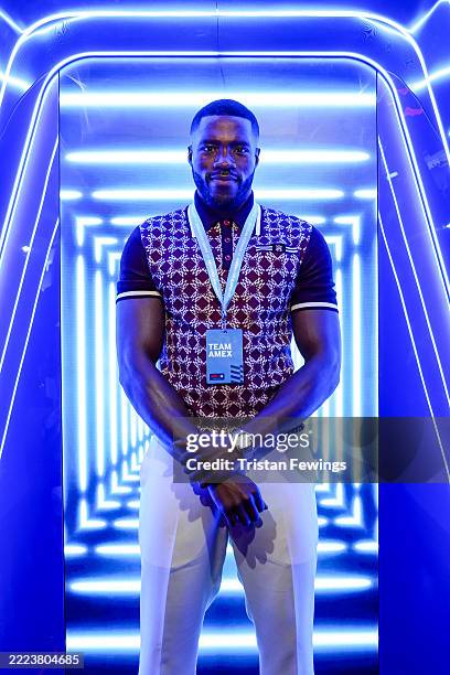 Amex Ambassador, Martins Imhangbe, soaks up the high-octane race day action at the Amex Fan Experience at the FORMULA 1® QATAR AIRWAYS BRITISH GRAND...