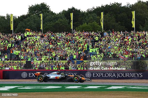 Race winner Lando Norris of Great Britain driving the McLaren MCL39 Mercedes waves to fans on his way to parc ferme during the F1 Grand Prix of Great...