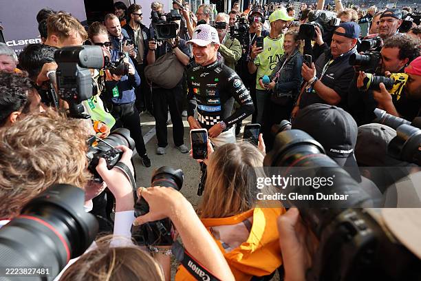 Race winner Lando Norris of Great Britain and McLaren celebrates with his team during the F1 Grand Prix of Great Britain at Silverstone Circuit on...