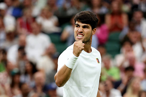 Carlos Alcaraz of Spain celebrates a point against Andrey Rublev during the Gentlemen's Singles fourth round match on day seven of The Championships...
