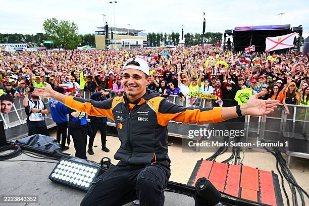 Race winner Lando Norris of Great Britain and McLaren on the fan stage after the F1 Grand Prix of Great Britain at Silverstone Circuit on July 06,...