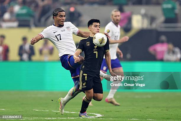 Gilberto Mora of the Mexico dribbles the ball while being defended by Malik Tillman of the United States in the second half during the finals of the...
