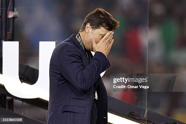 Head coach Mauricio Pochettino of the United States walks off the stage after receiving his silver medal after Mexico beat the United States 2-1 to...