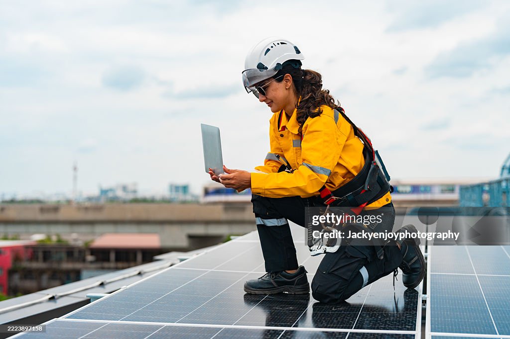 In a solar power plant, a solar engineer uses an AI-driven app.