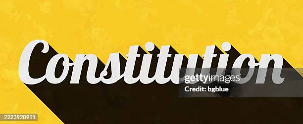 constitution - text with long shadow on textured yellow background - constitution paper stock illustrations