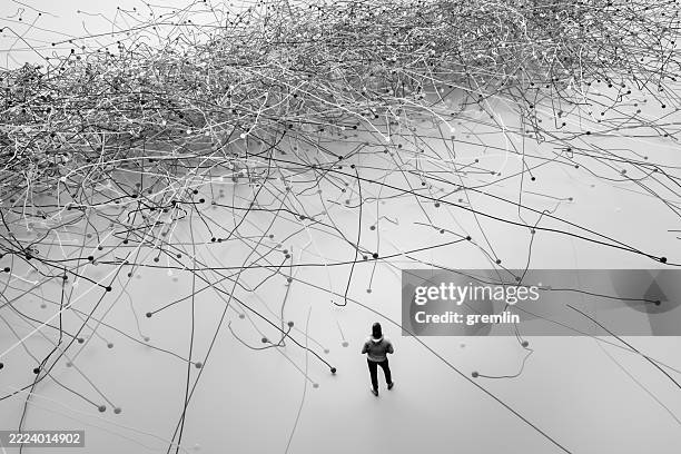 man facing complex problems - complexidade imagens e fotografias de stock