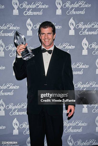 American actor Mel Gibson holding up a trophy during the 23rd Annual People's Choice Awards at the Barker Hangar in Santa Monica, California, January...