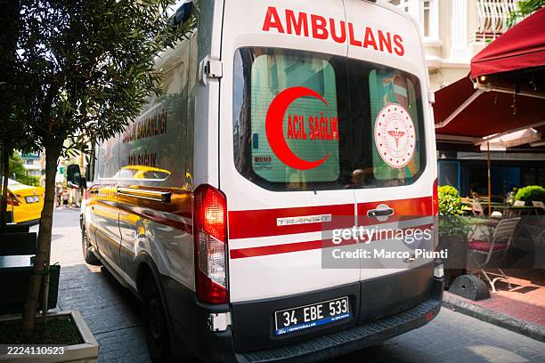 ambulance driving through istanbul street - istanbul province stock pictures, royalty-free photos & images