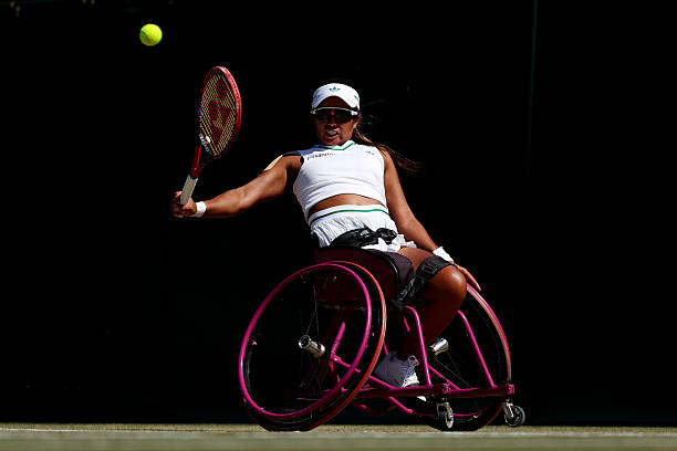 Angelica Bernal of Colombia plays a backhand against Yui Kamiji of Japan during the Ladies' Wheelchair Singles First Round match on day nine of The...